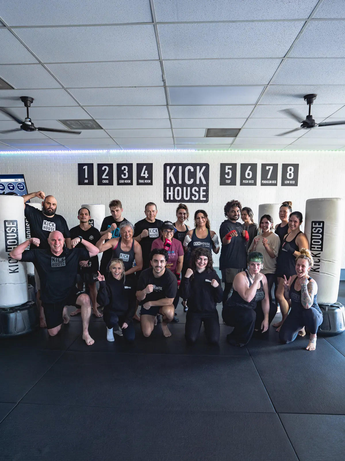 A Los Alamitos class together in front of the combination wall