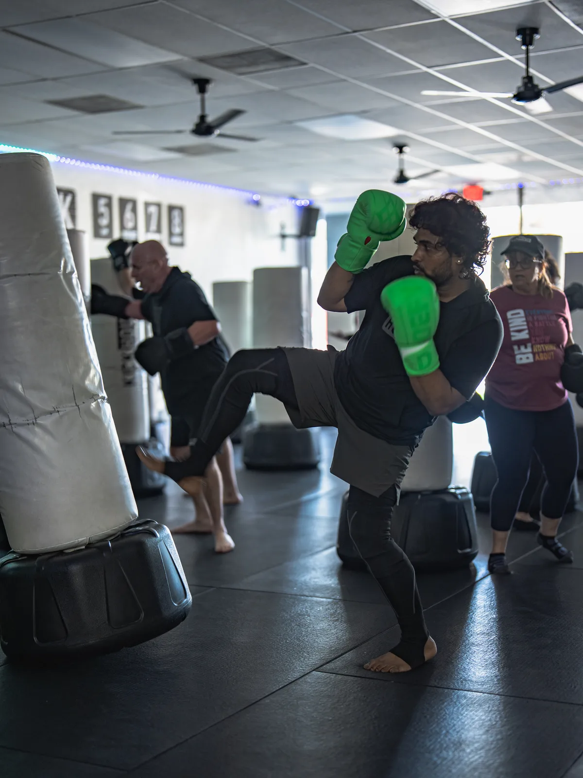 A Los Alamitos member landing a kick in class